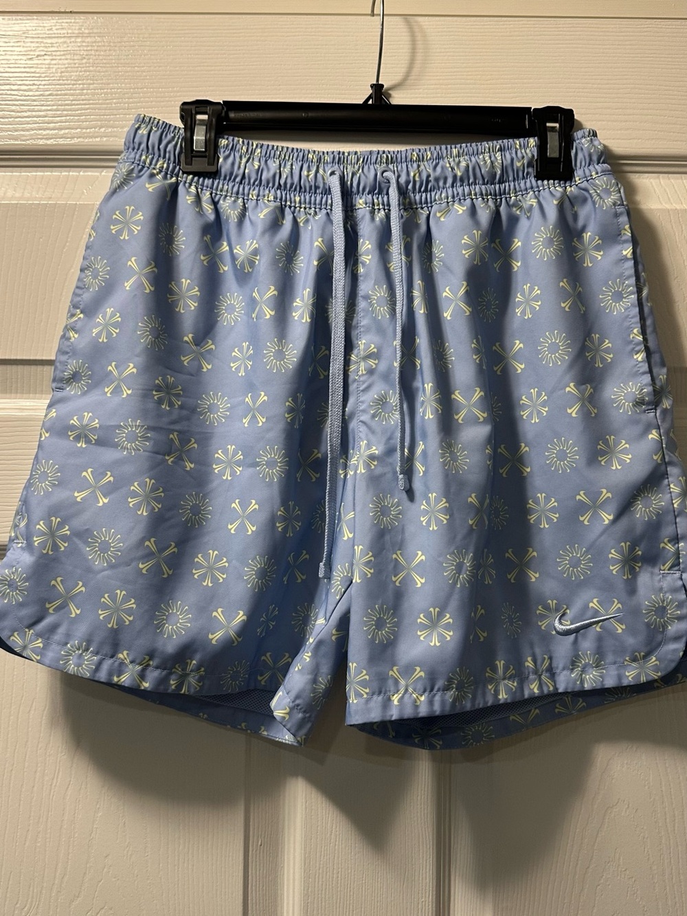 Nike Light Blue Athletic Shorts with Pale Yellow Motif